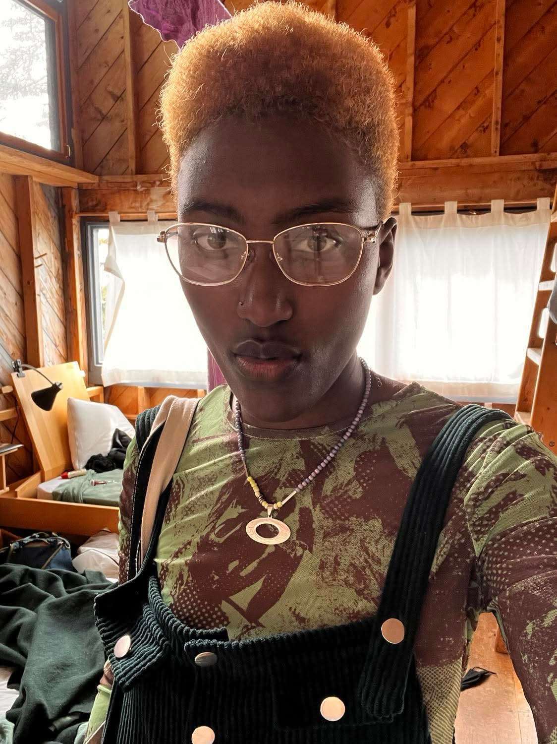 Kidist wearing a printed apron in the Haystack studio