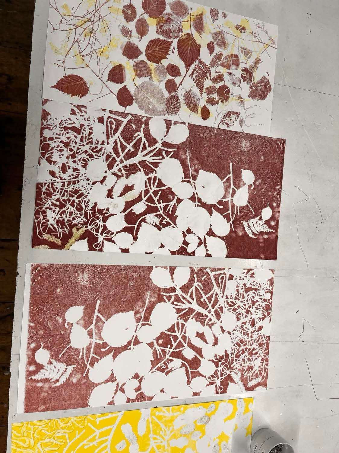 Red and brown lithography proof on a studio table